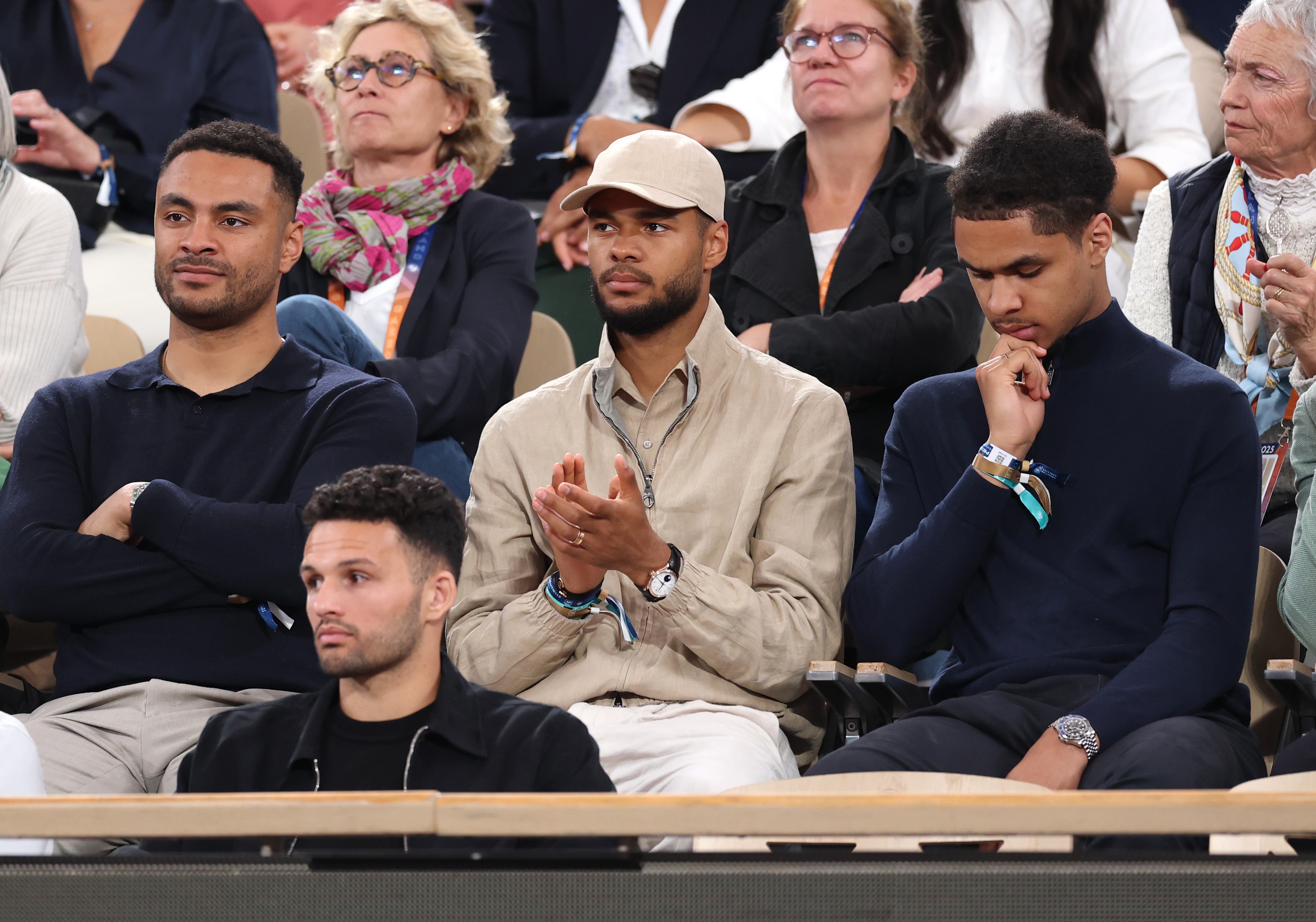 Cody Gakpo claps his hands whilst watching the French open.