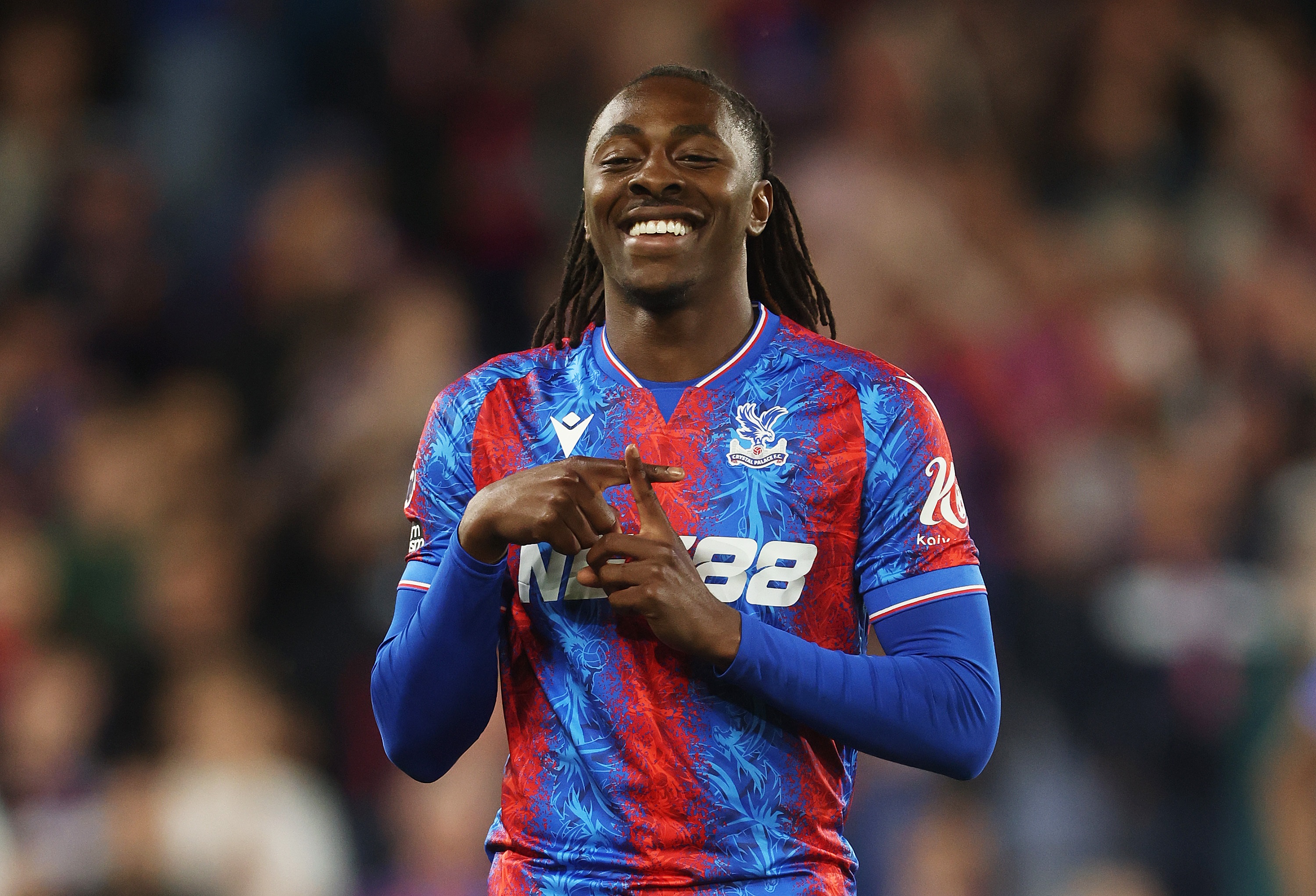 Eberechi Eze makes hand gesture in celebration of Crystal Palace goal.