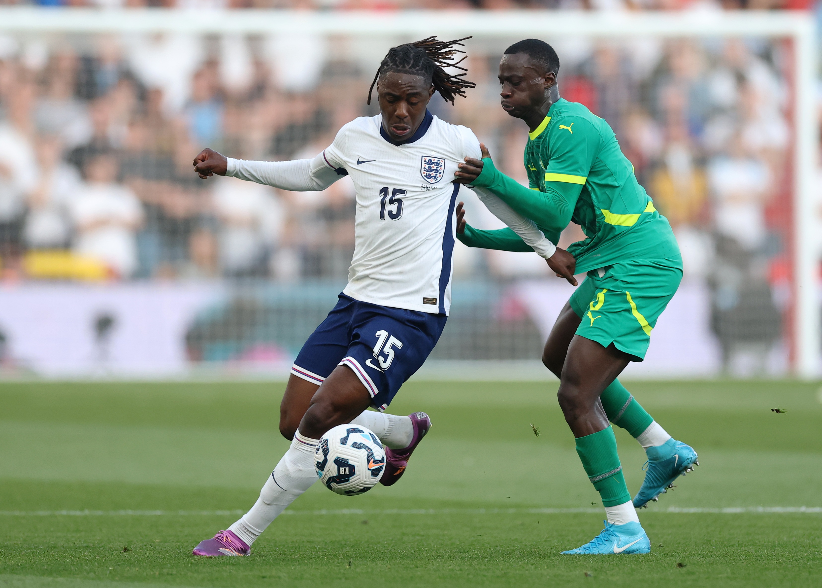 Eberechi Eze dribbles with the ball under pressure from Habib Diarra.