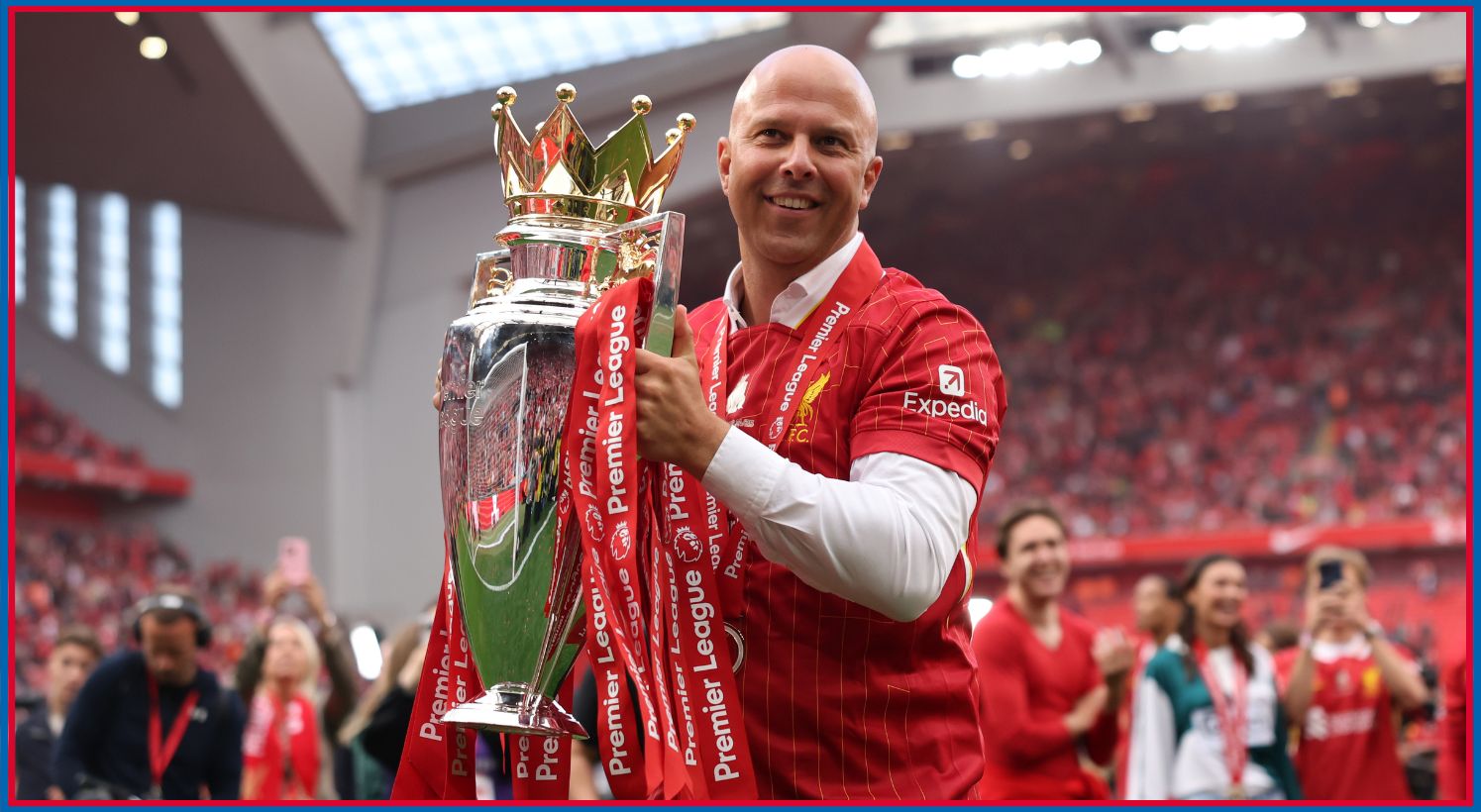 Arne Slot celebrates with the Premier League trophy