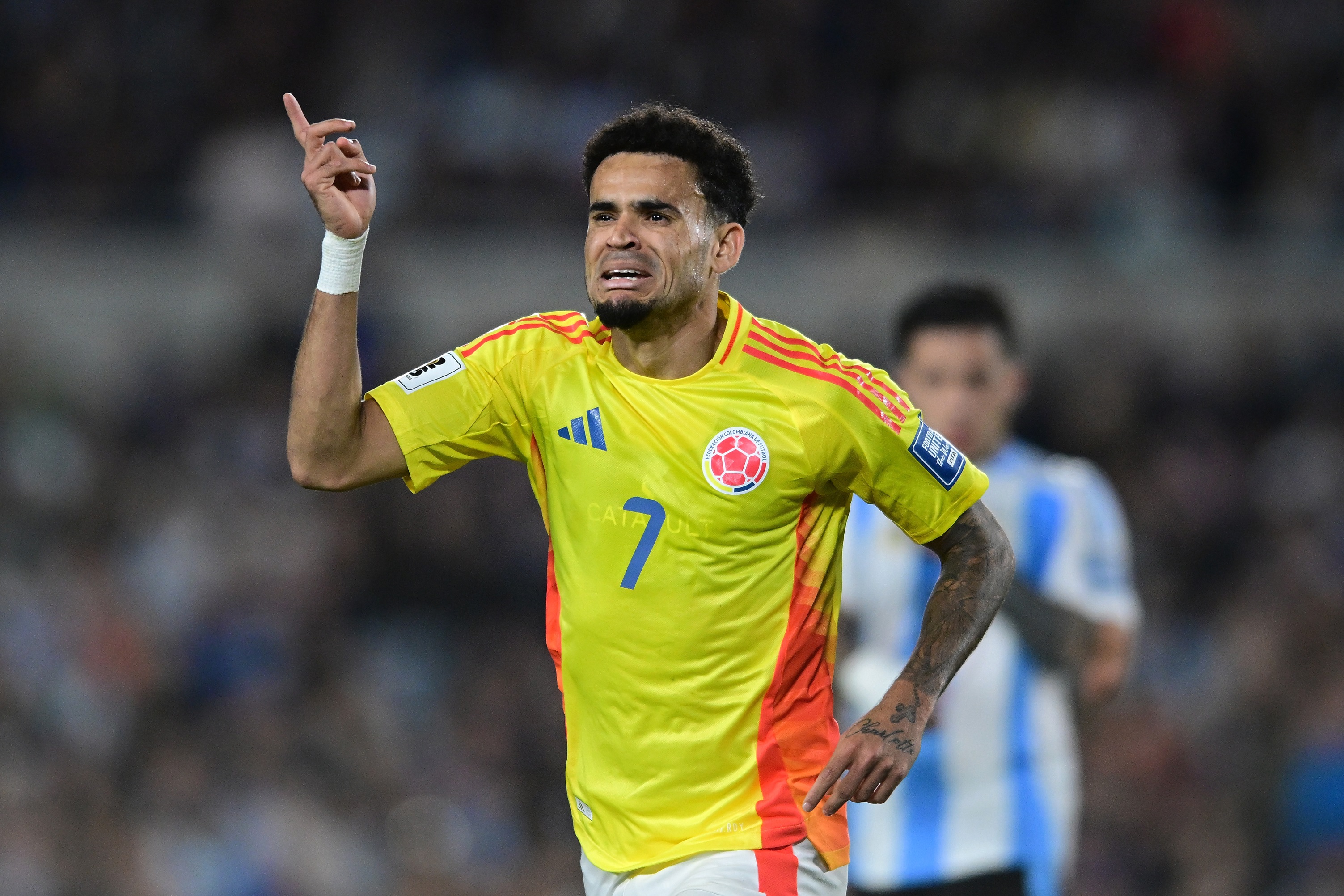 Luis Diaz waves a finger in the air in celebration during Colombia game.