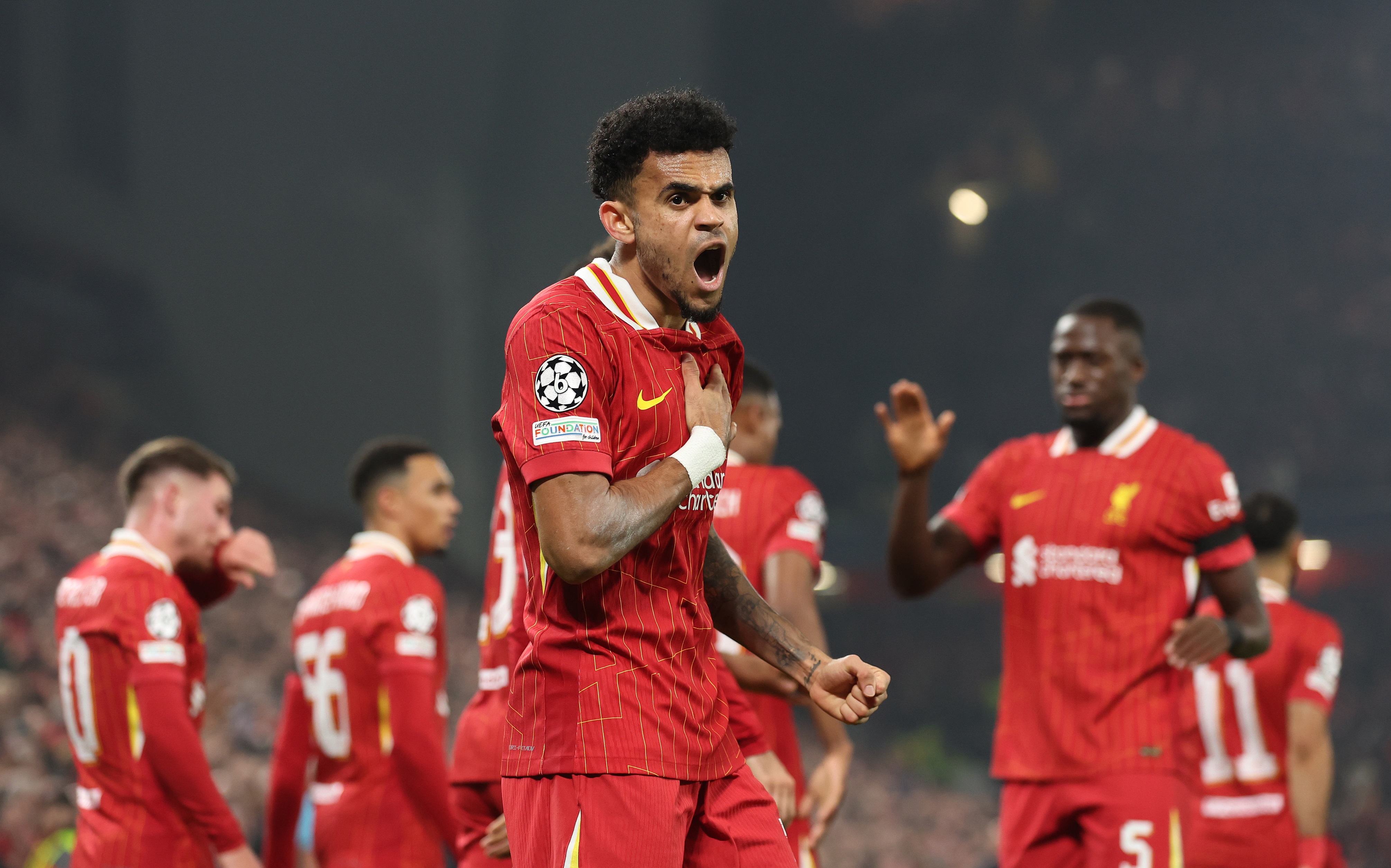 Luis Diaz touches his chest and screams during Liverpool game.