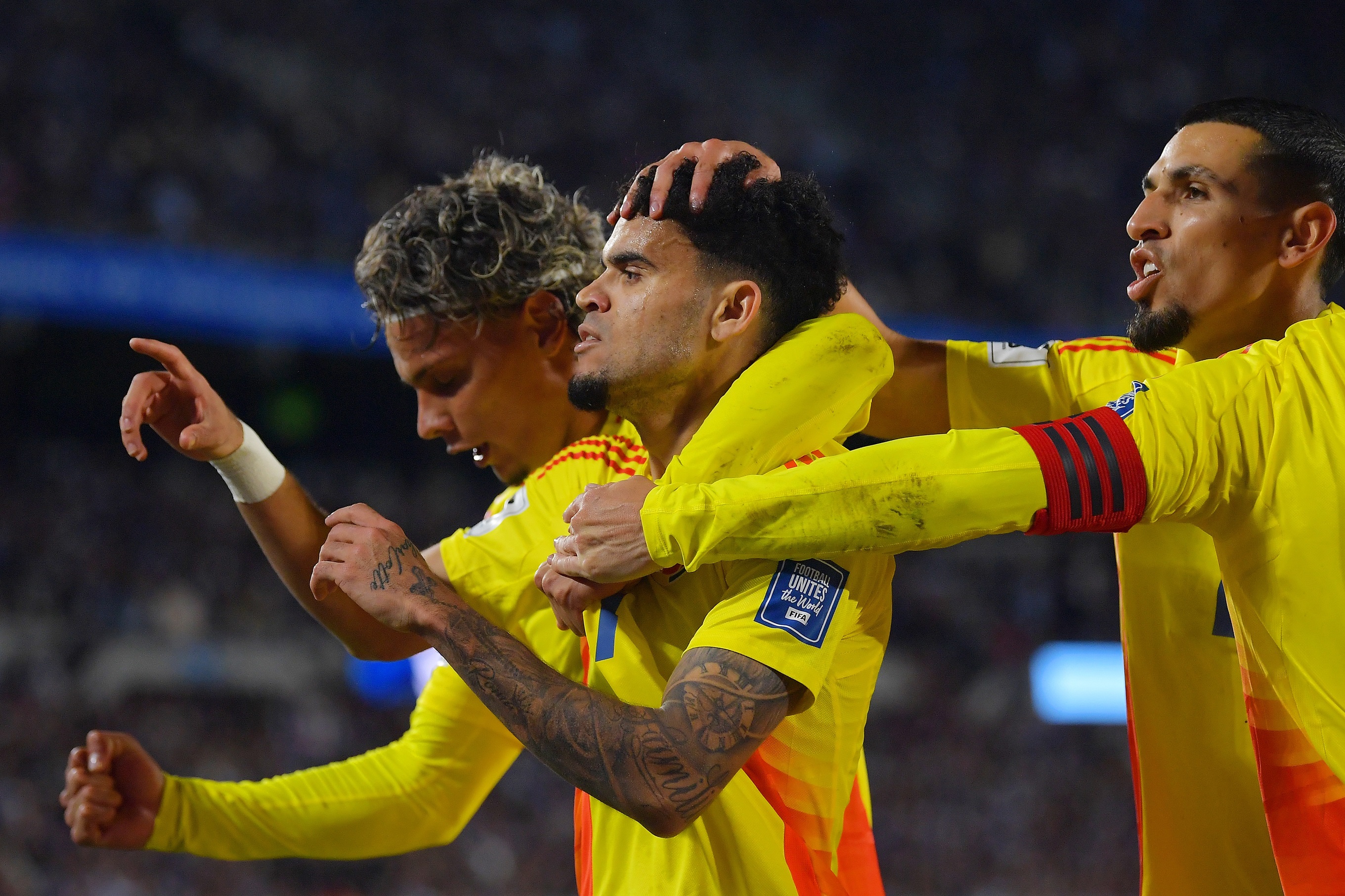 Luis Diaz celebrates with Colombian teammates.