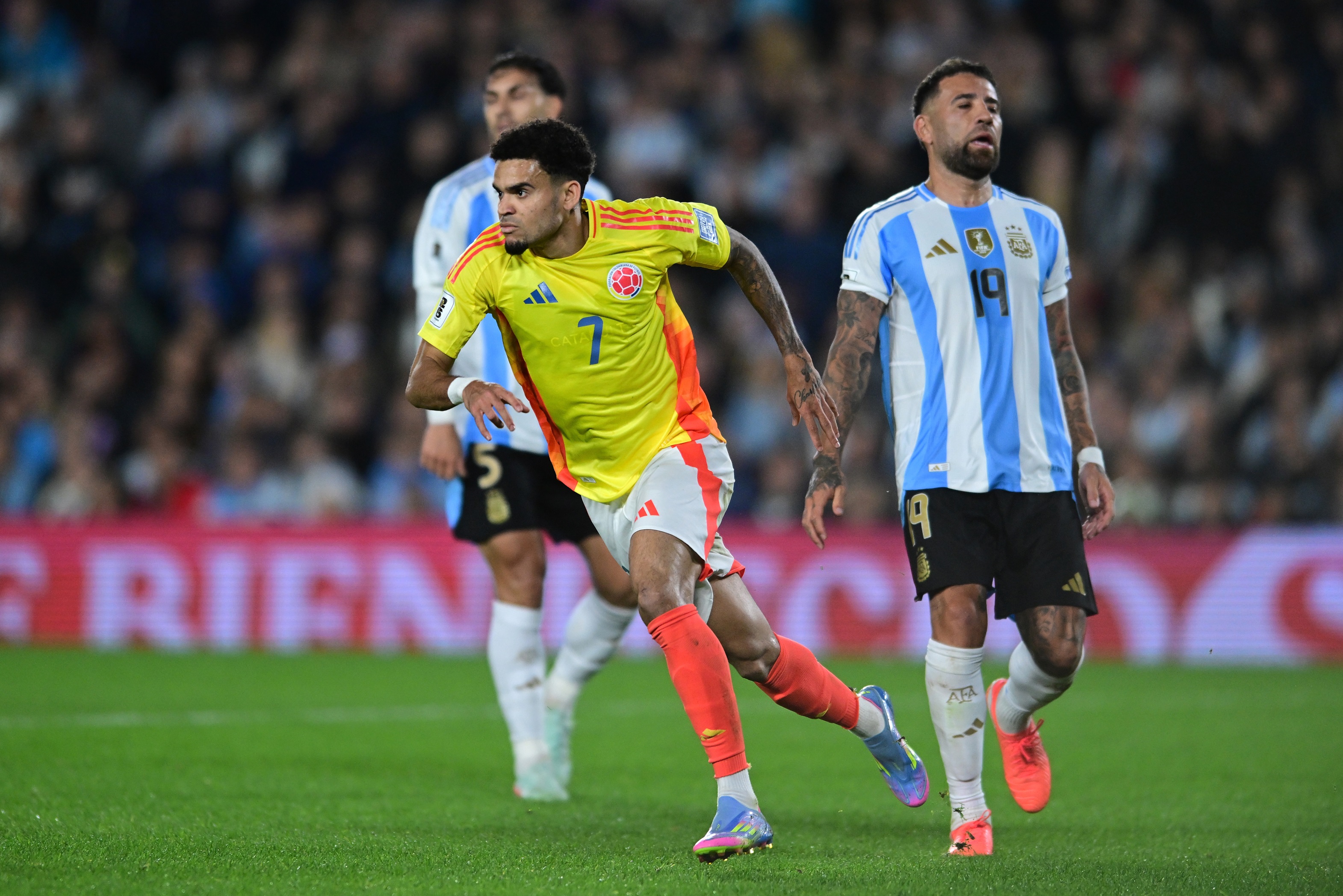 Luis Diaz runs away to celebrate scoring for Colombia.