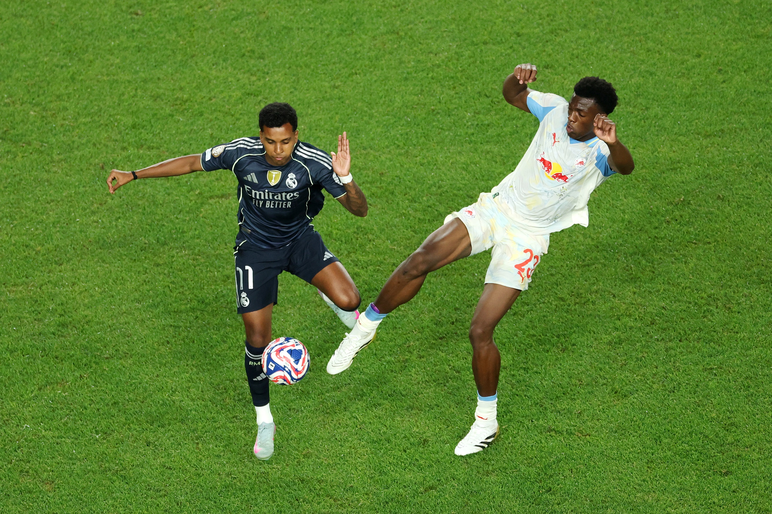 Rodrygo competes for the ball with RB Salzburg player.