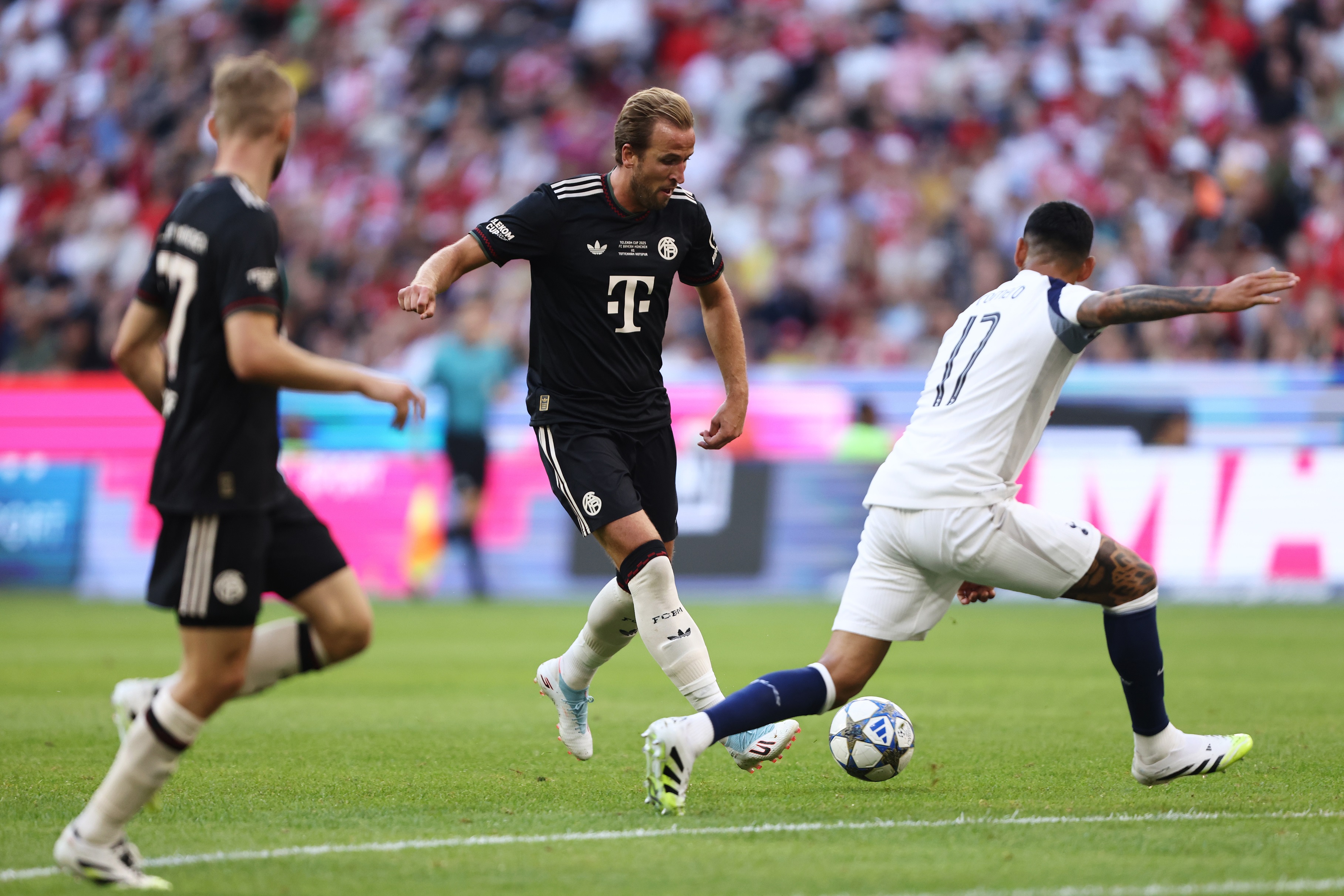 Harry Kane plays a pass during Bayern Munich v Tottenham.