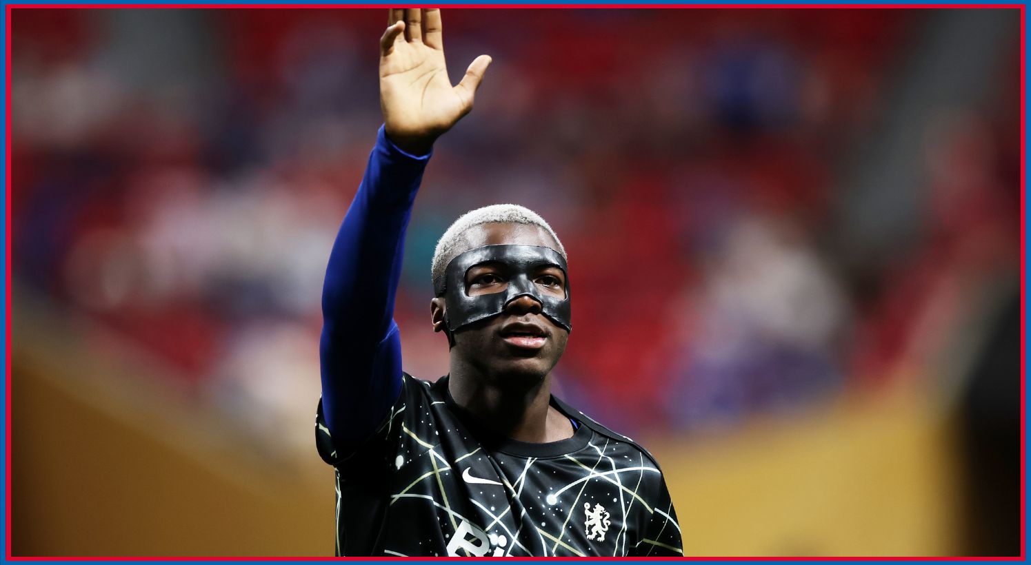 Nicolas Jackson waves towards Chelsea fans