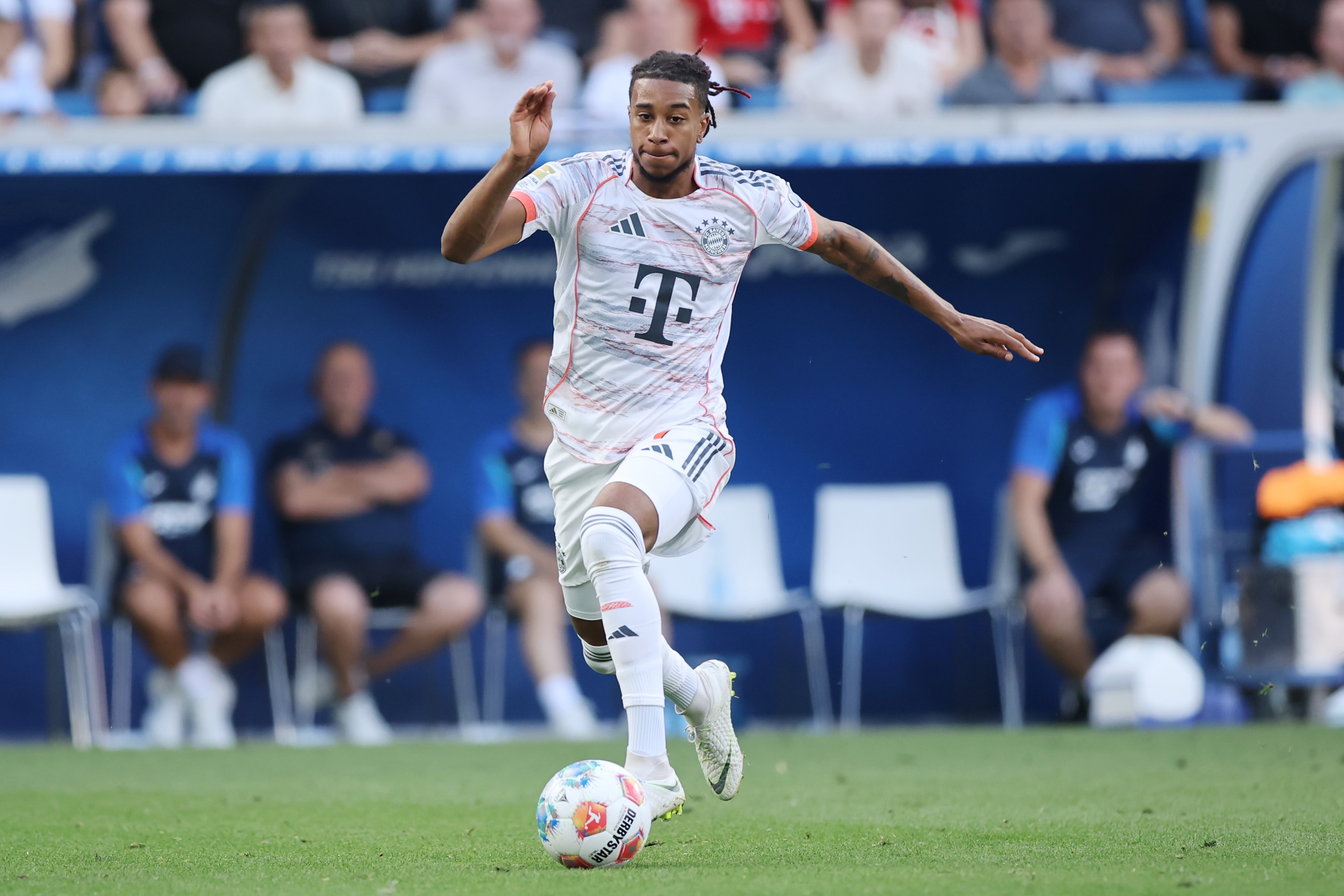Michael Olise dribbles with the ball during Bayern game.