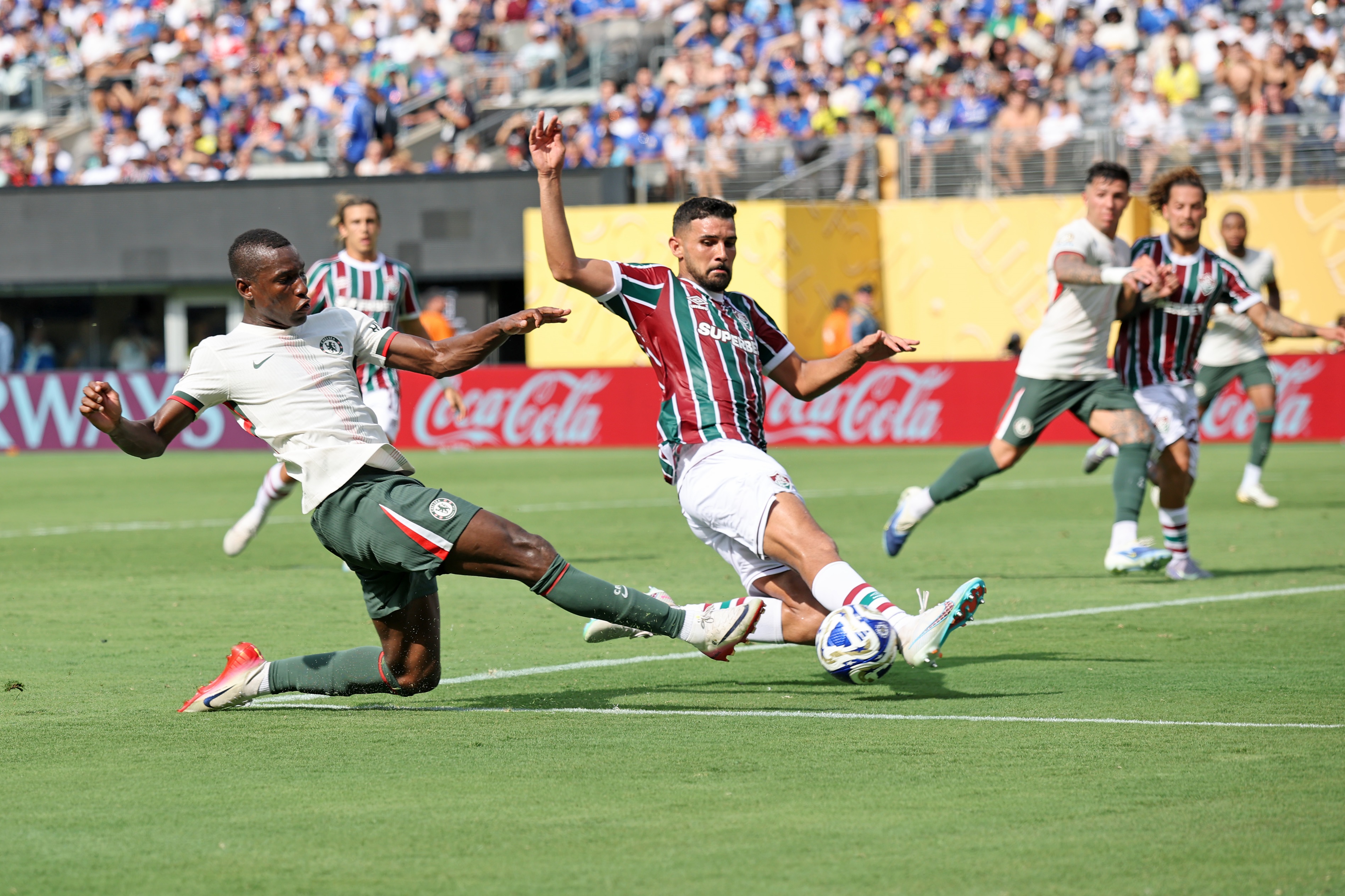 Nicolas Jackson lunges with one leg to reach the ball.