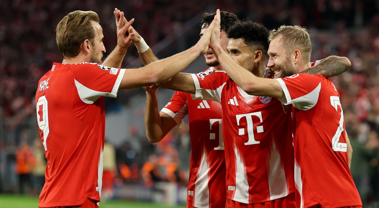 Harry Kane celebrates with Bayern players