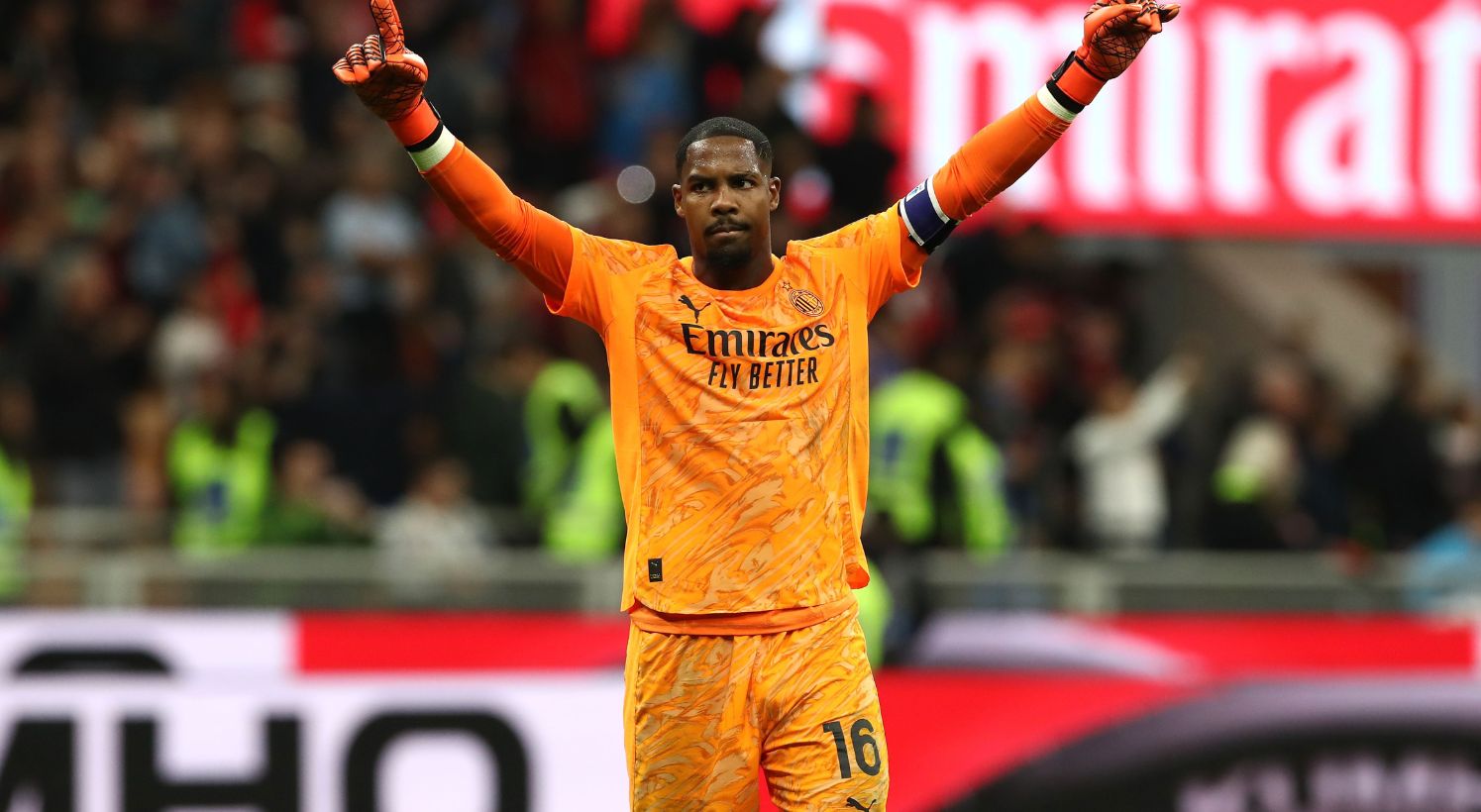 Mike Maignan celebrates AC Milan win