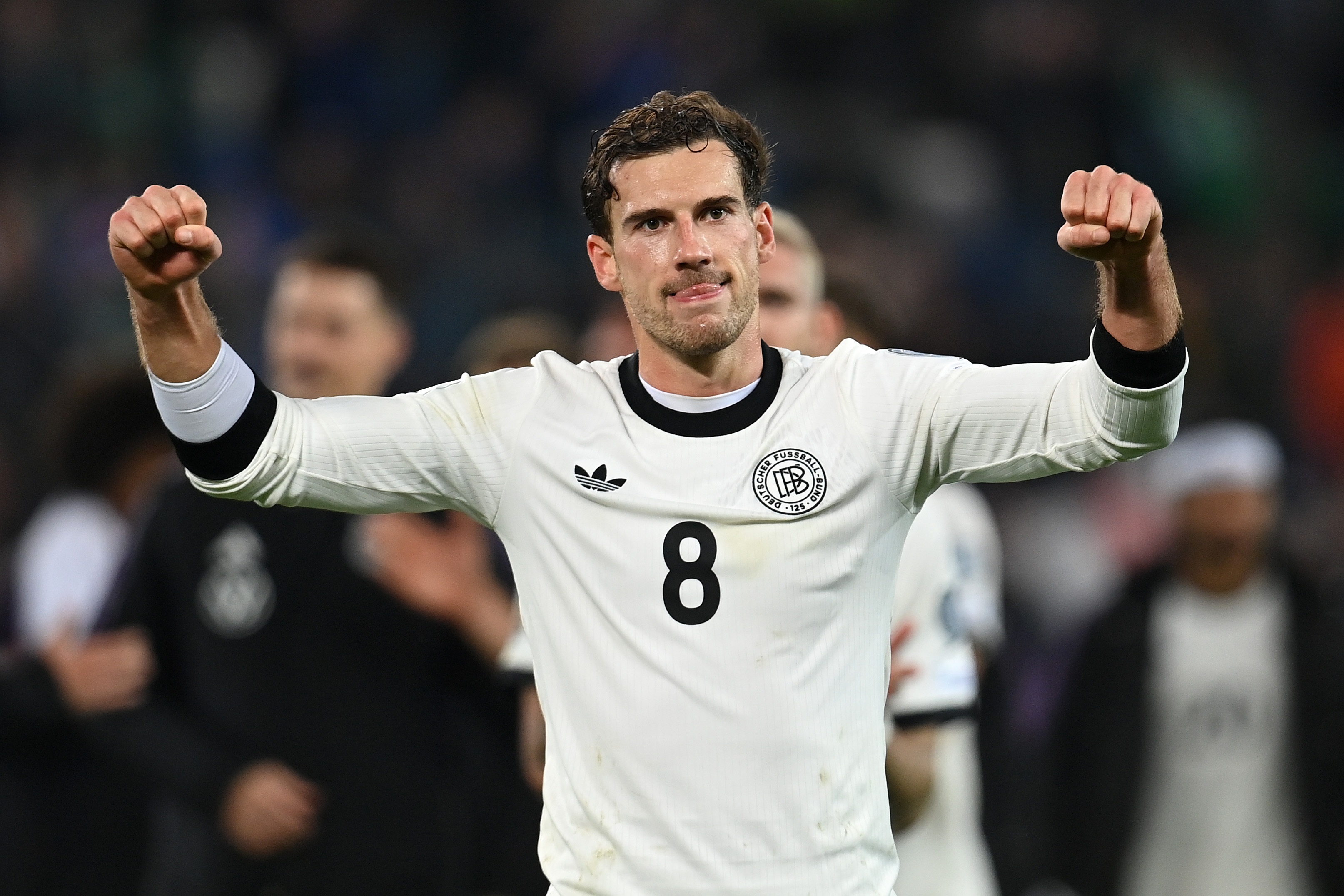Leon Goretzka pumps his fists in celebration.
