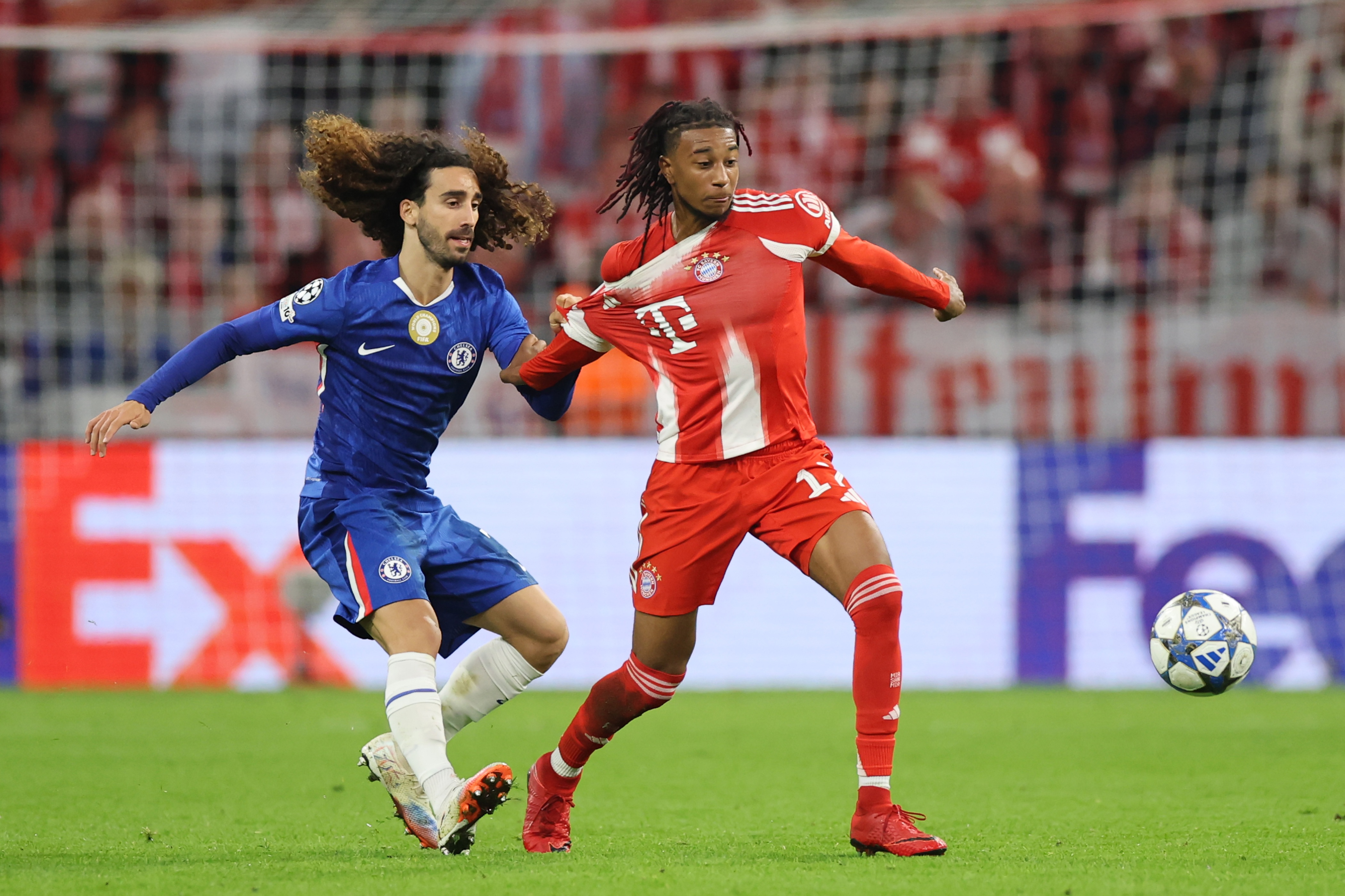 Chelsea defender Marc Cucurella pulls Michael Olise's shirt.
