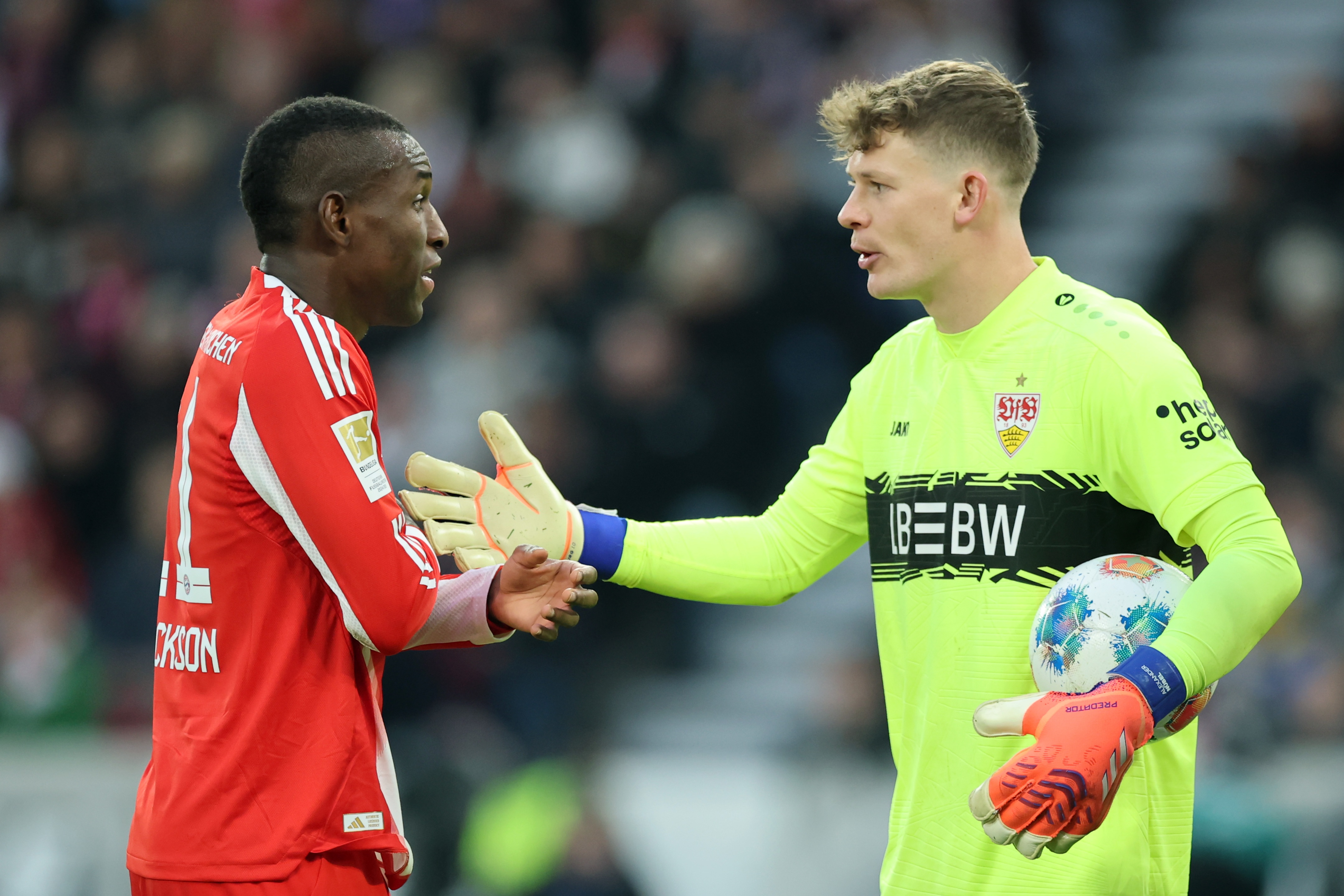 Alexander Nubel in discussion with Nicolas Jackson.