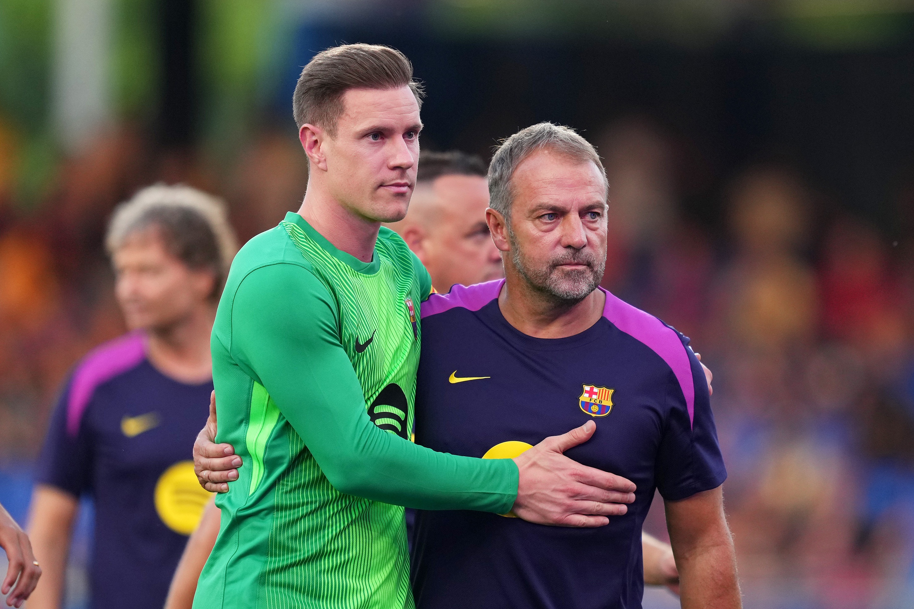 Marc-Andre Ter Stegen embraces Barcelona head coach Hansi Flick.