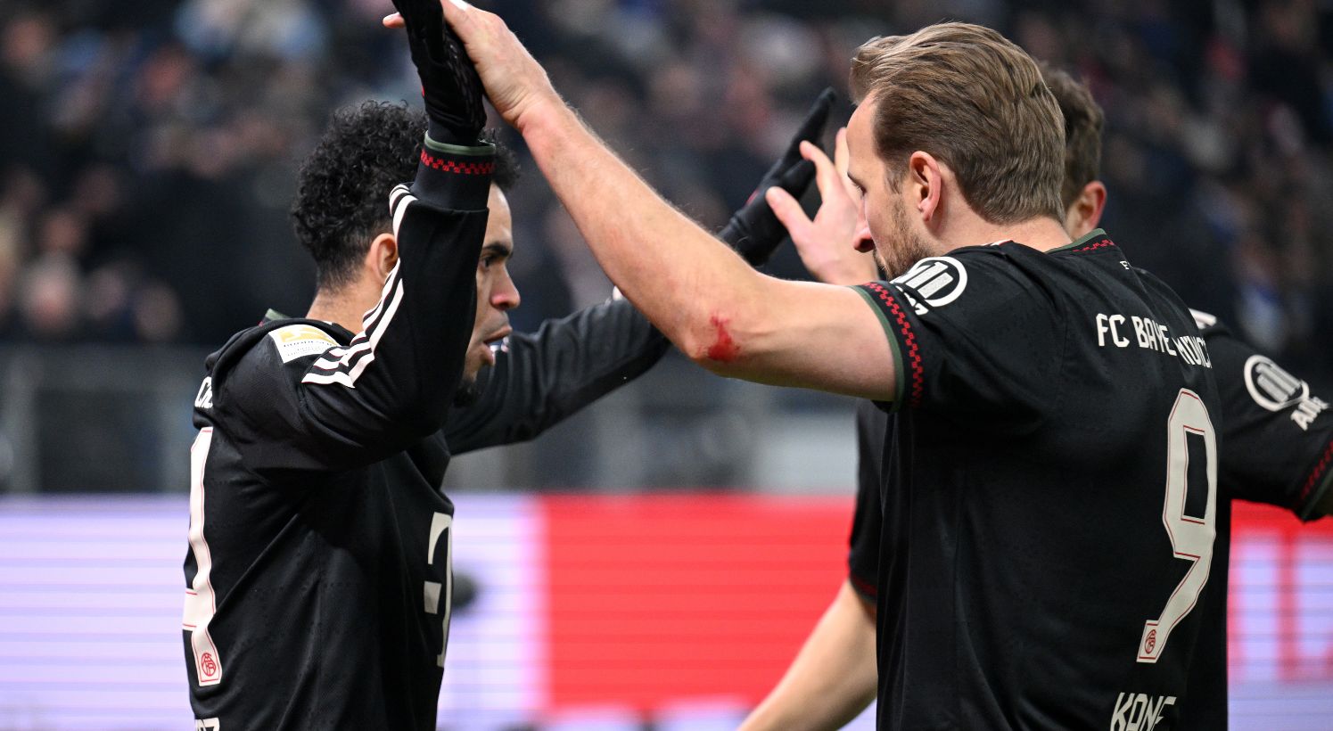 Luis Diaz celebrates goal with Harry Kane 