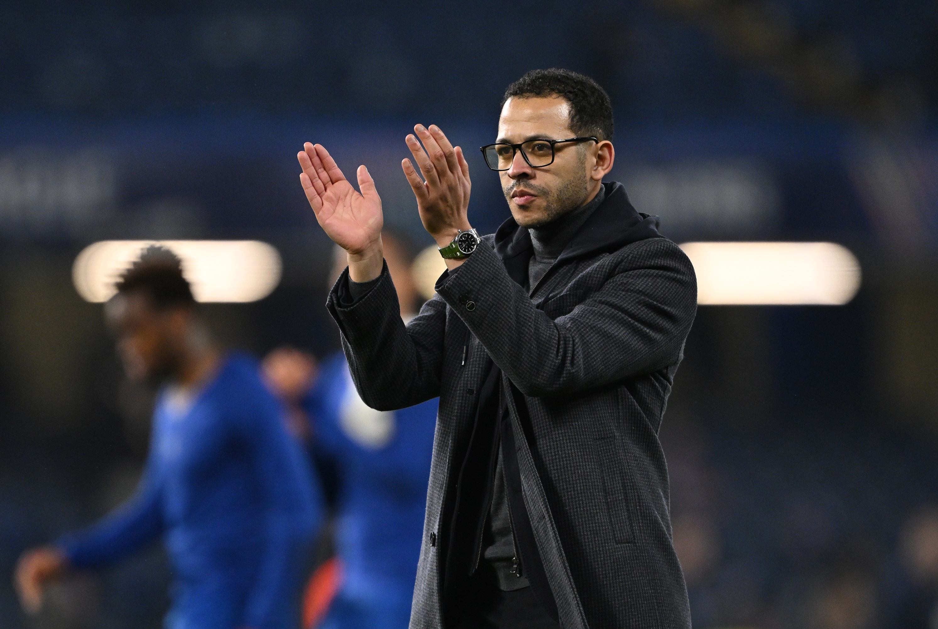 Liam Rosenior claps his hands during Chelsea game.