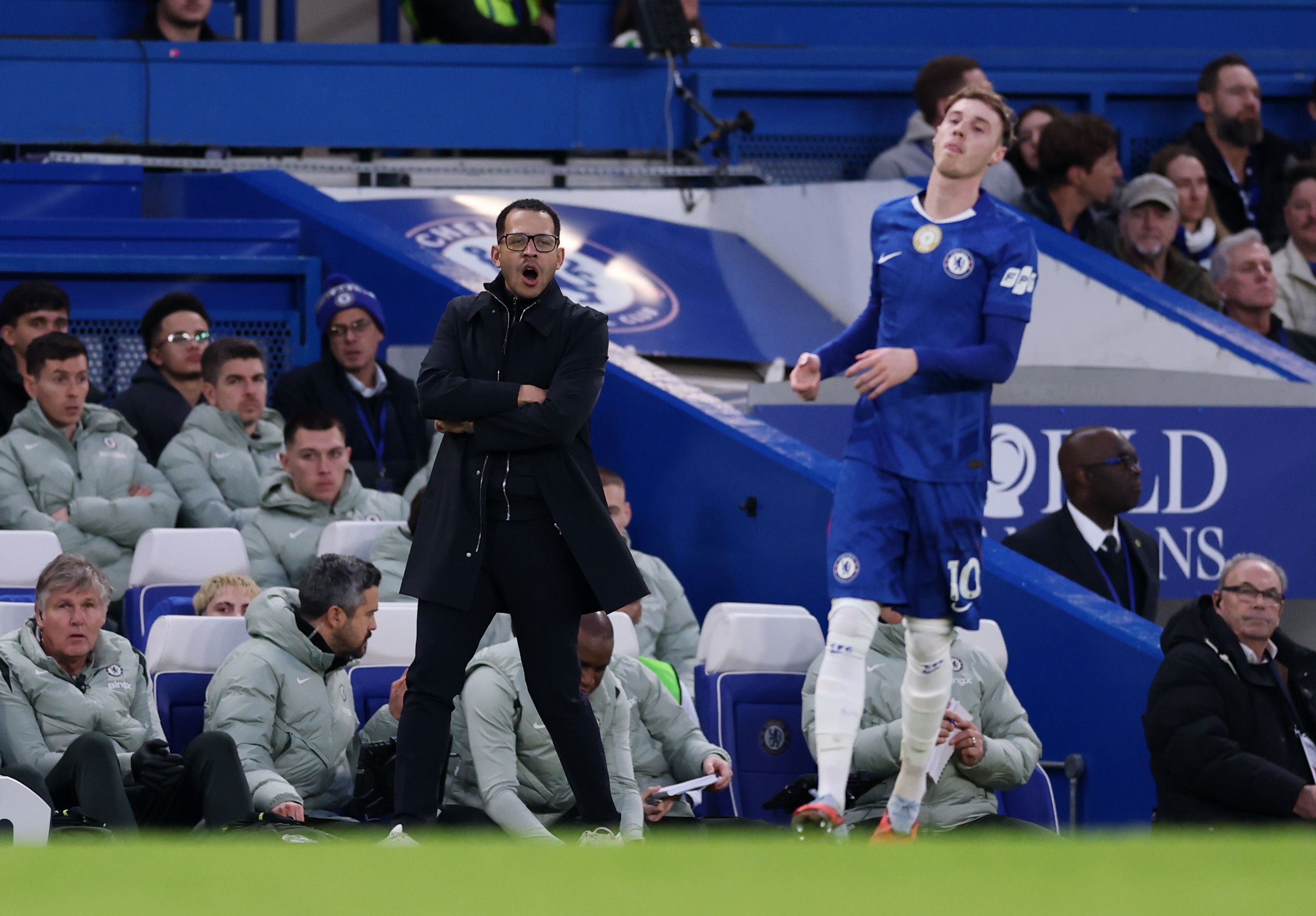 Chelsea manager Liam Rosenior shouts from the touchline.