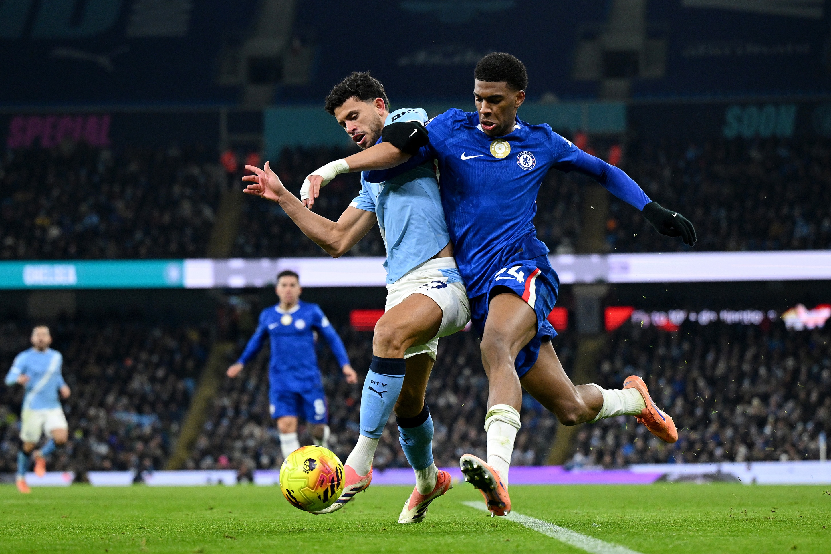 Josh Acheampong jostles Matheus Nunes during Chelsea game.