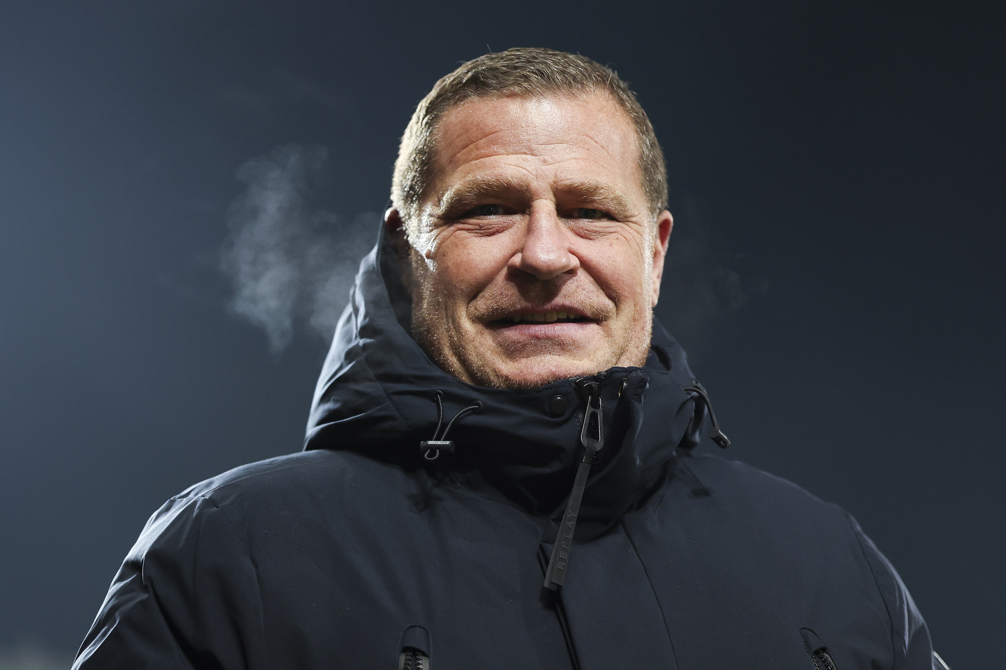 Max Eberl looks on during Bayern match.