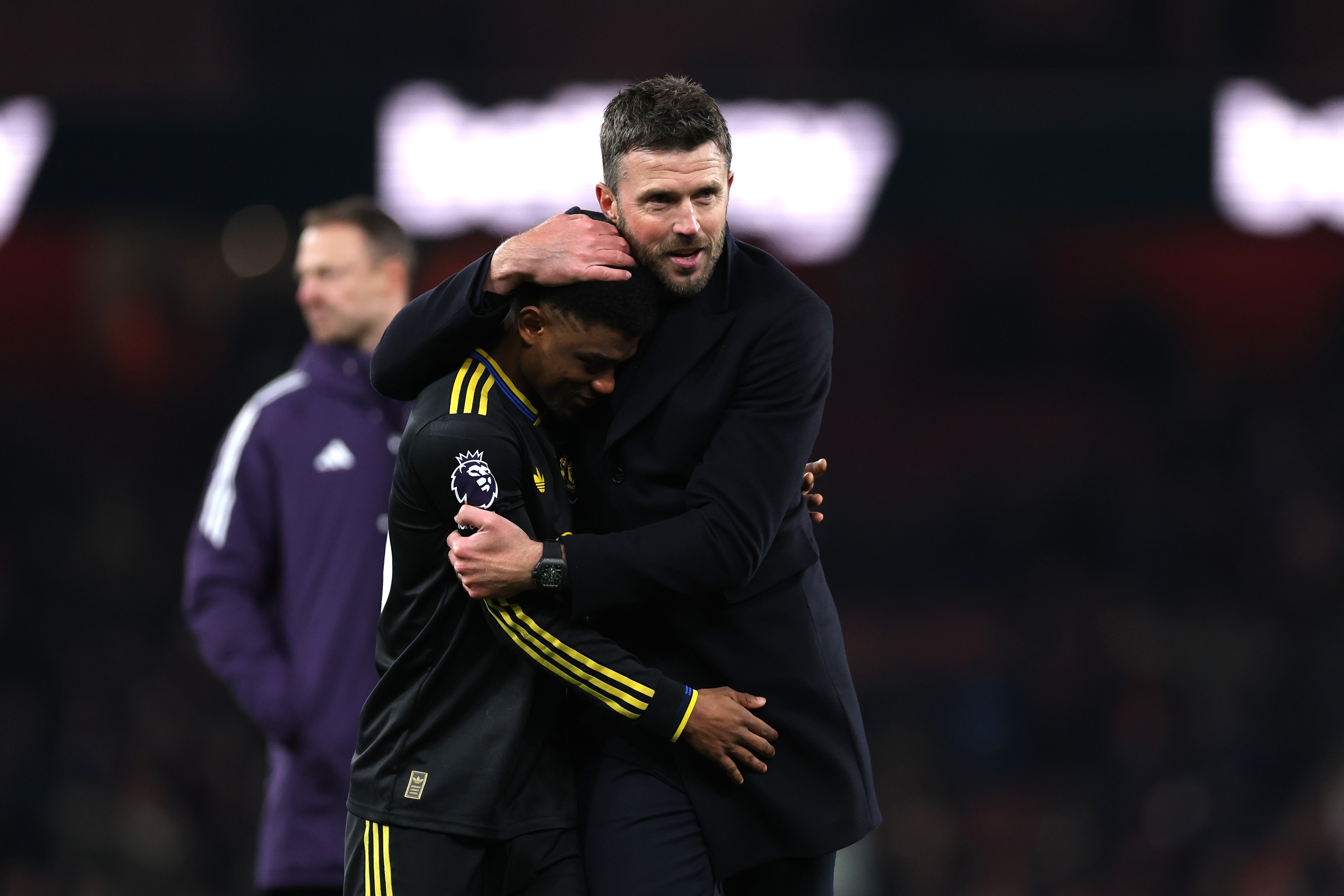 Manchester United head coach Michael Carrick hugs Amad Diallo.