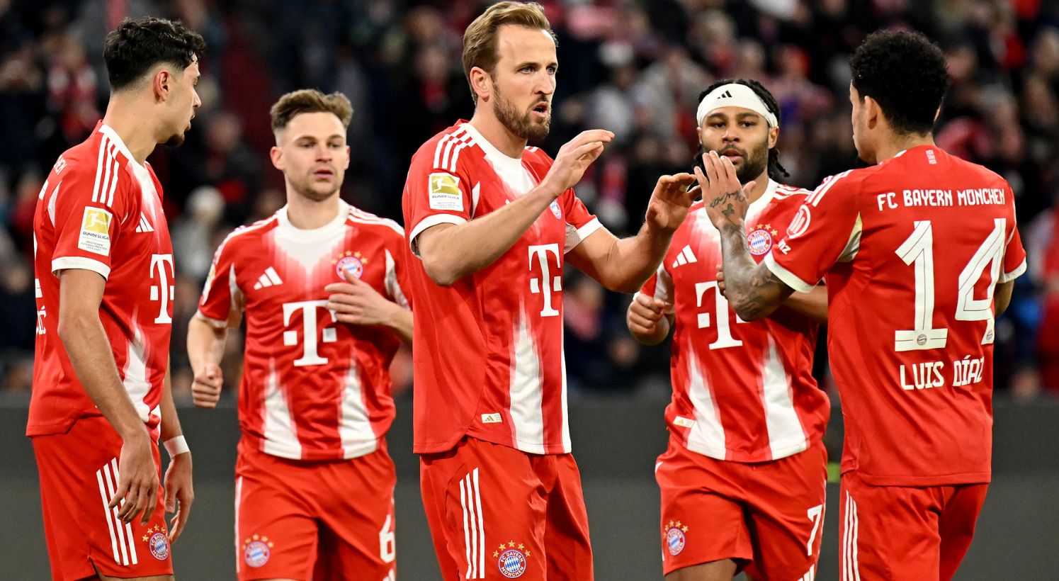Harry Kane congratulated by Bayern teammates 