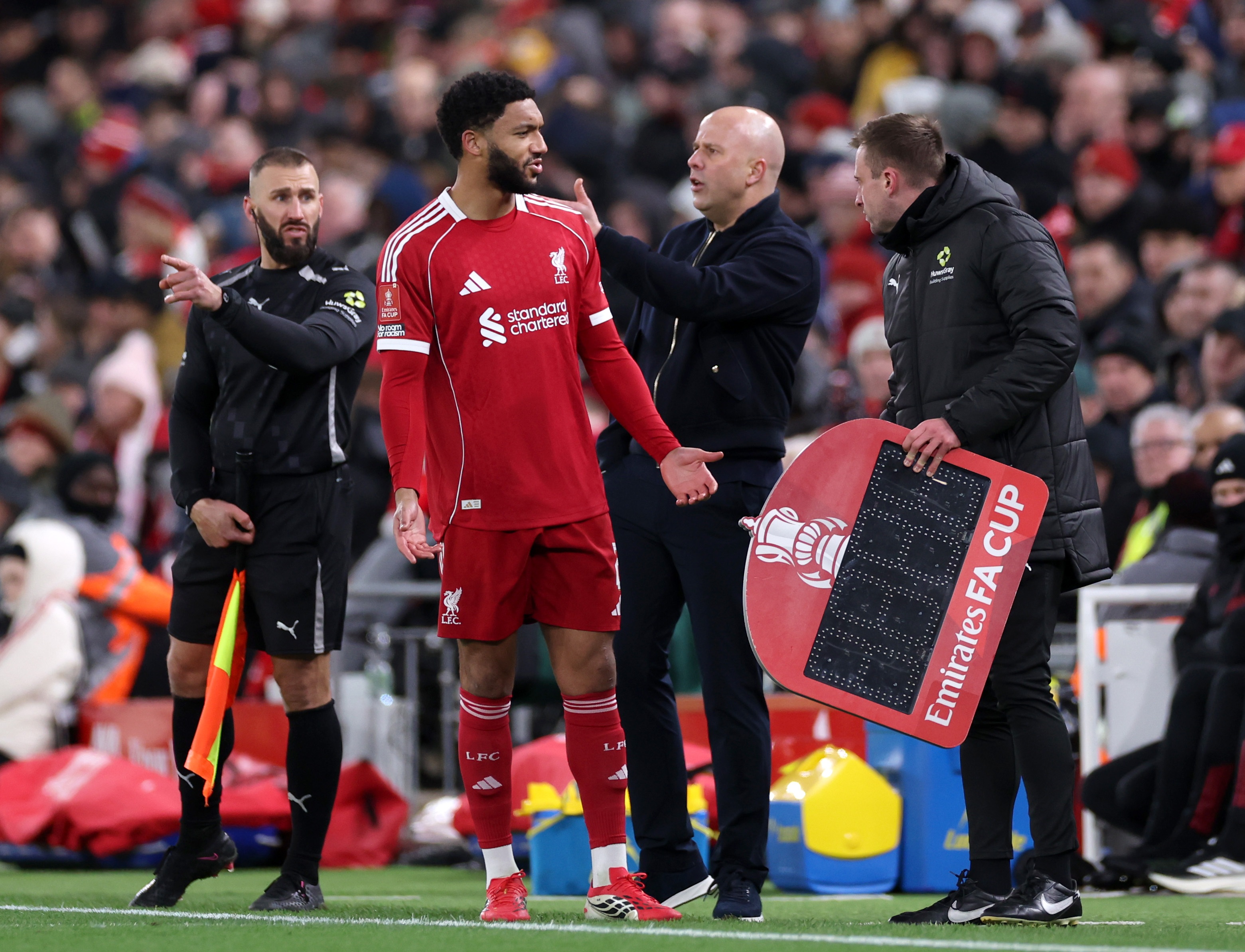 Joe Gomez reacts on the touchline during Liverpool game.