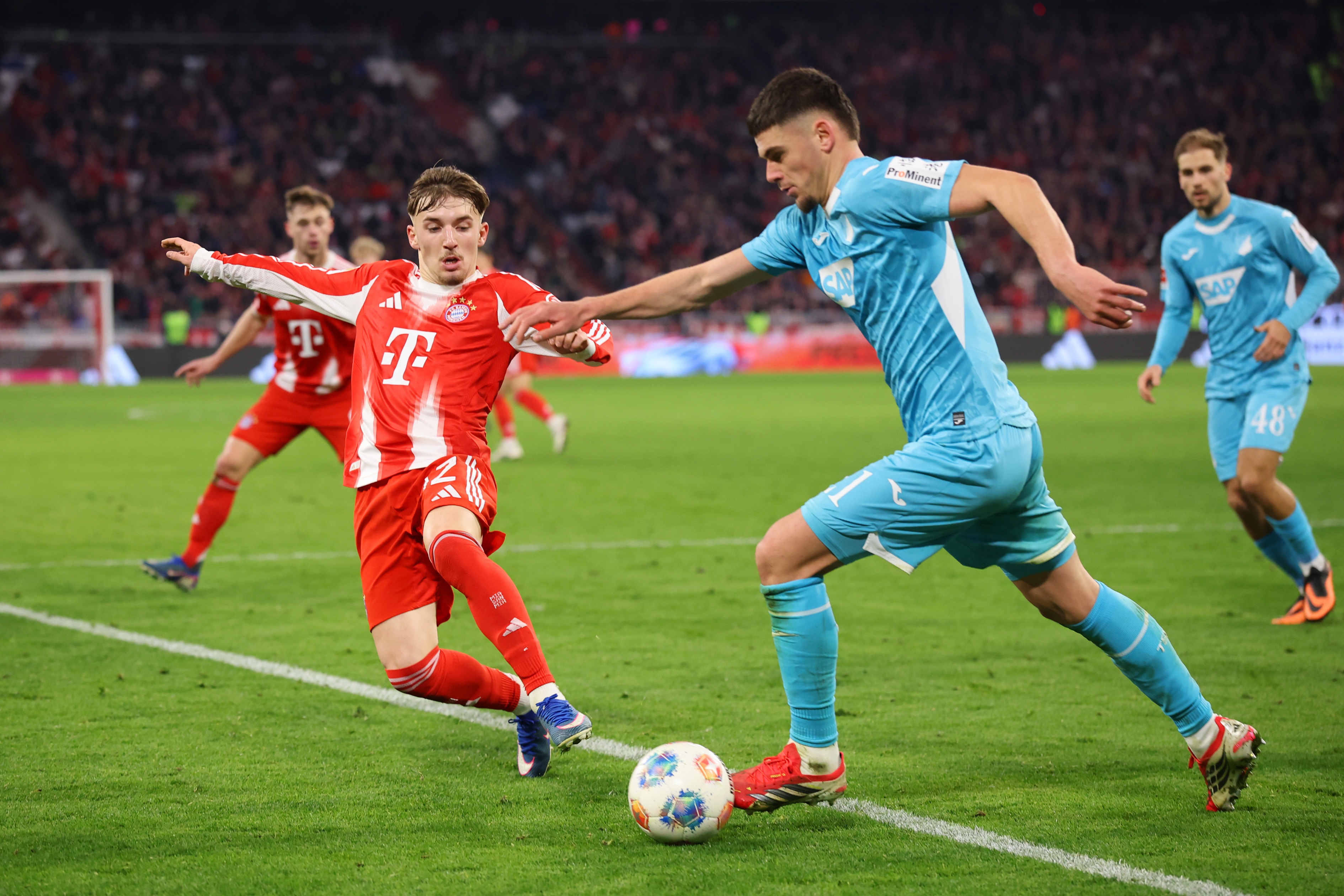 Lennart Karl tries to tackle Albian Hajdari during Bayern game.