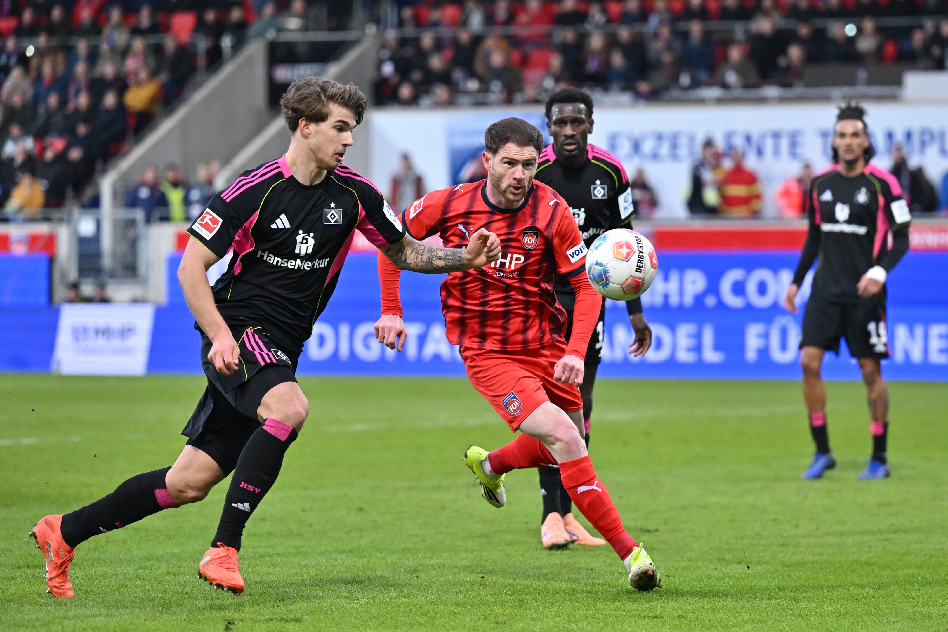 Luka Vuskovic competes with Budu Zivzivadze for the ball.