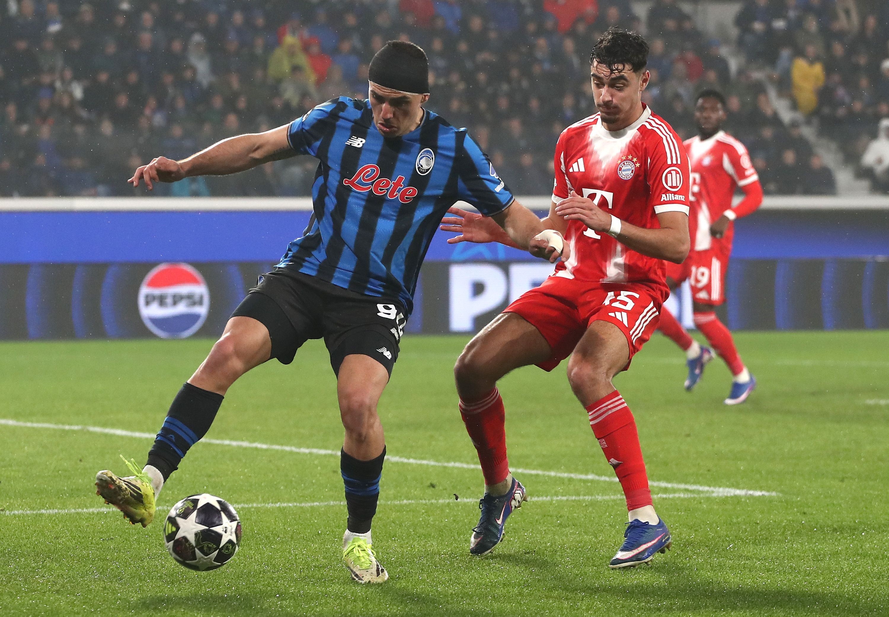 Aleksandar Pavlovic puts pressure on Nikola Krstovic.