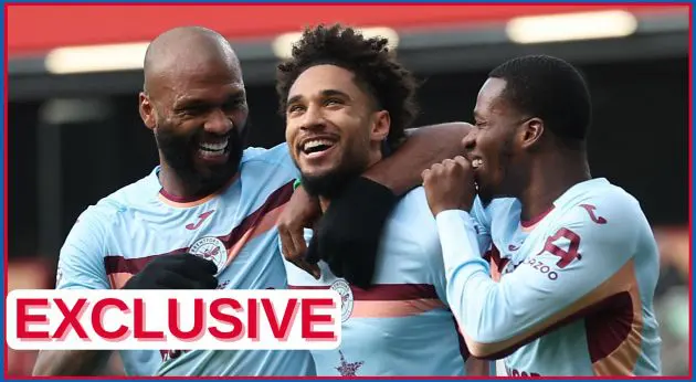 Kevin Schade celebrates with Brentford teammates.