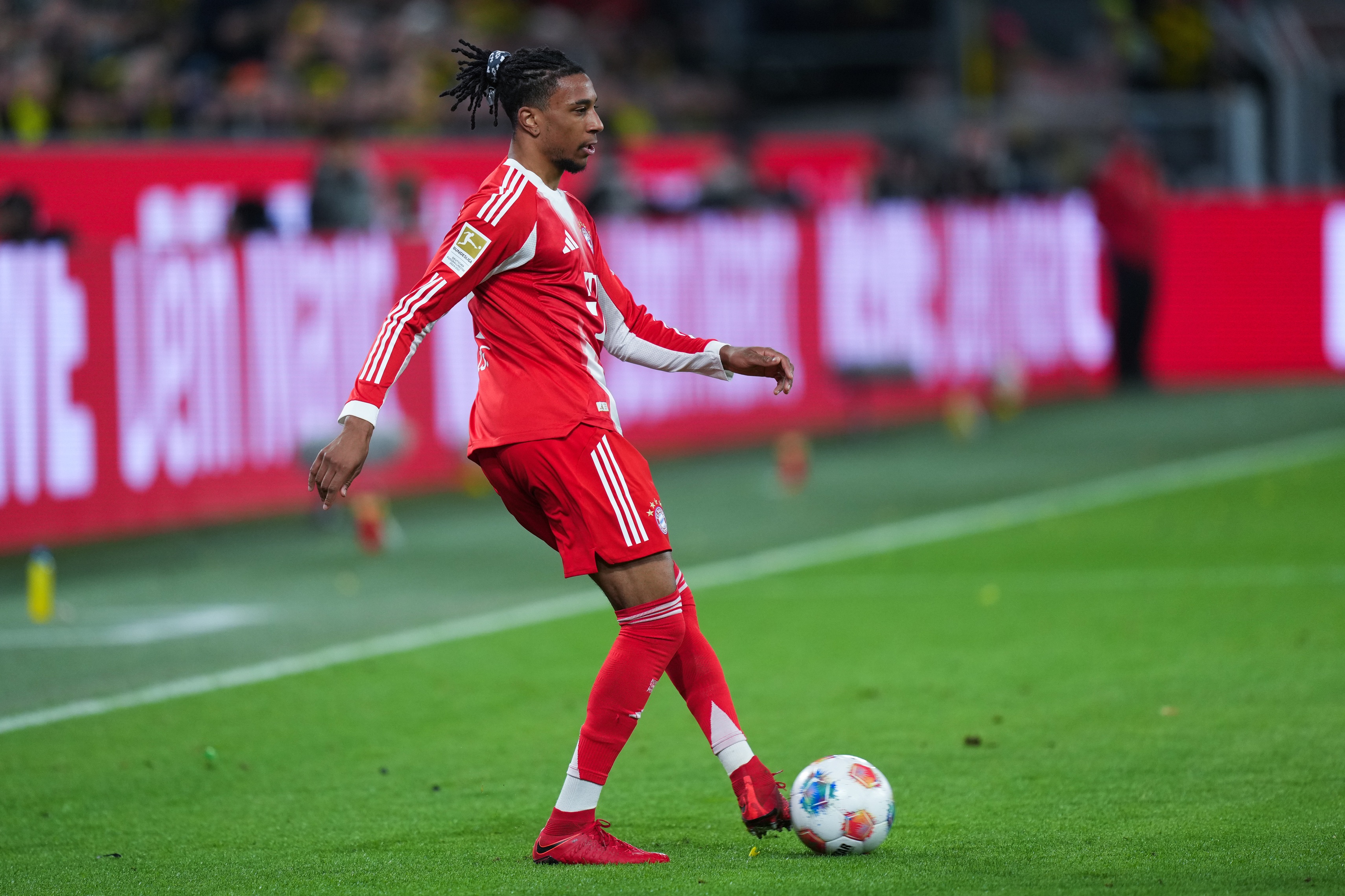 Michael Olise controls the ball during a Bayern Munich game.