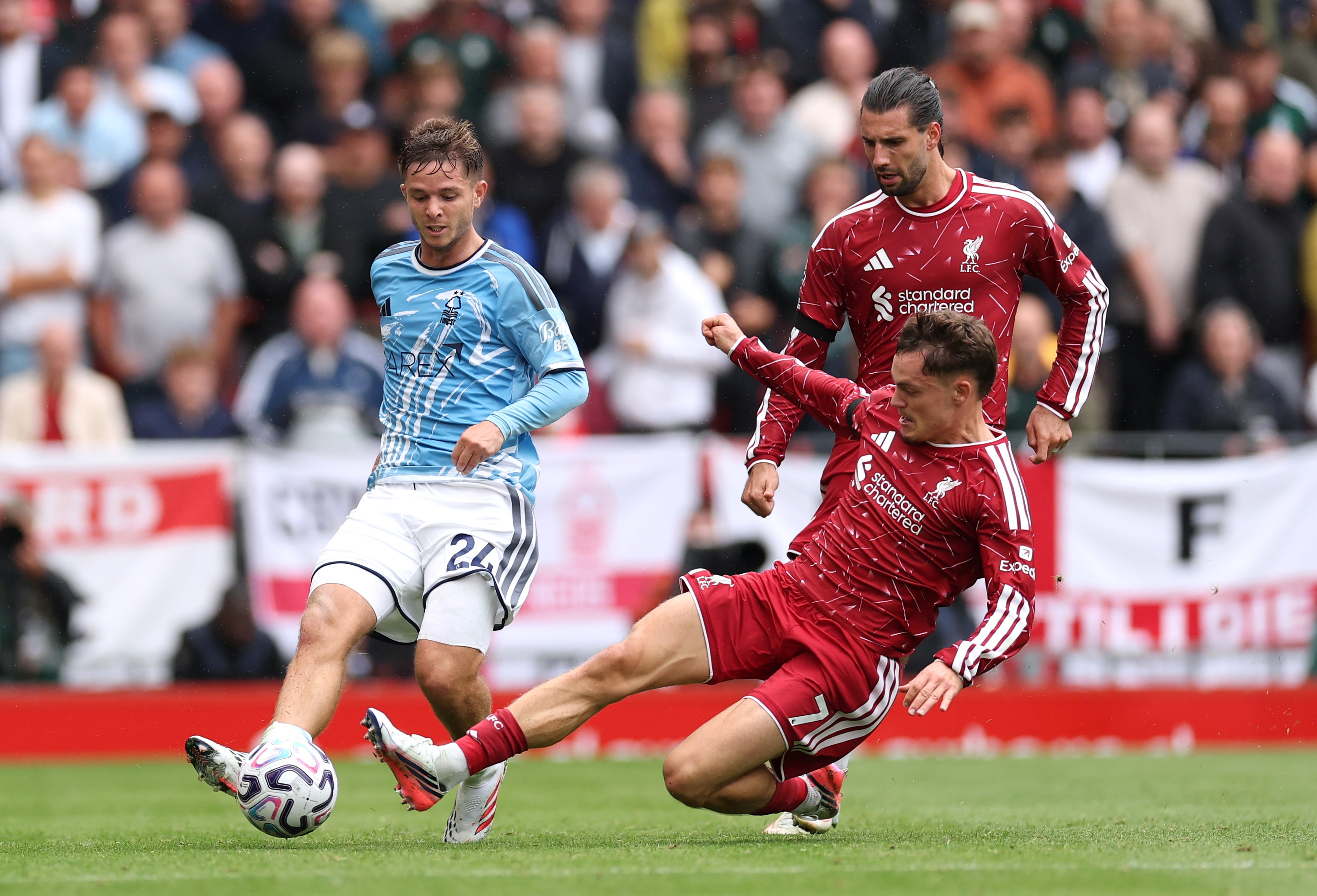 Florian Wirtz goes to ground to tackle an opponent.