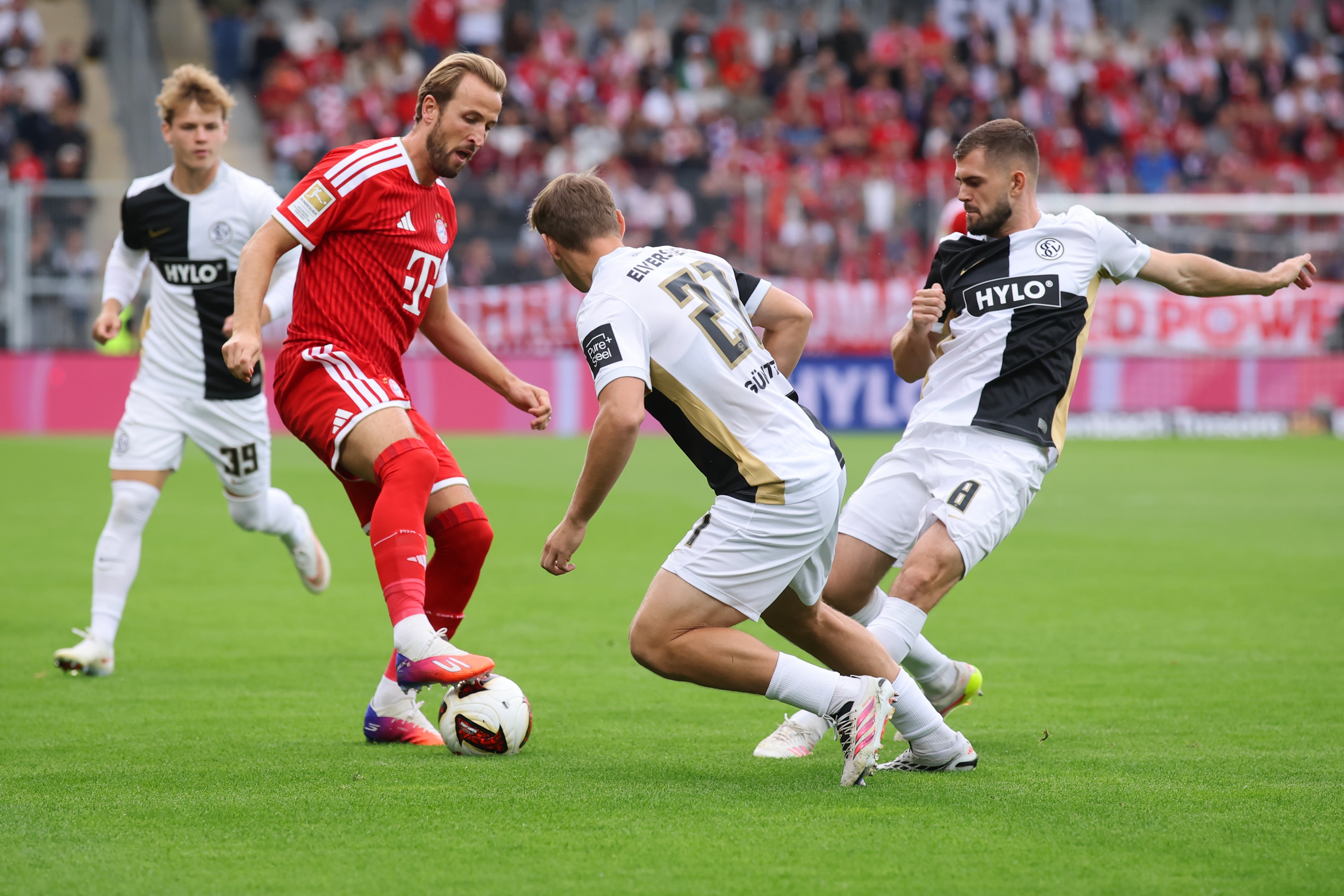 Bayern striker Harry Kane puts a boot on the ball during game with Elversberg.