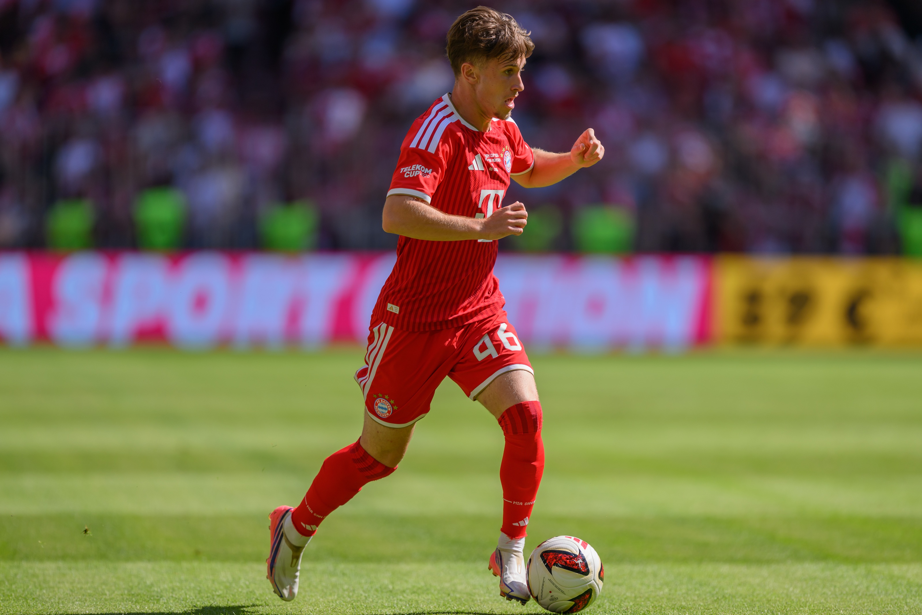 Tim Binder dribbles on the ball for Bayern Munich.