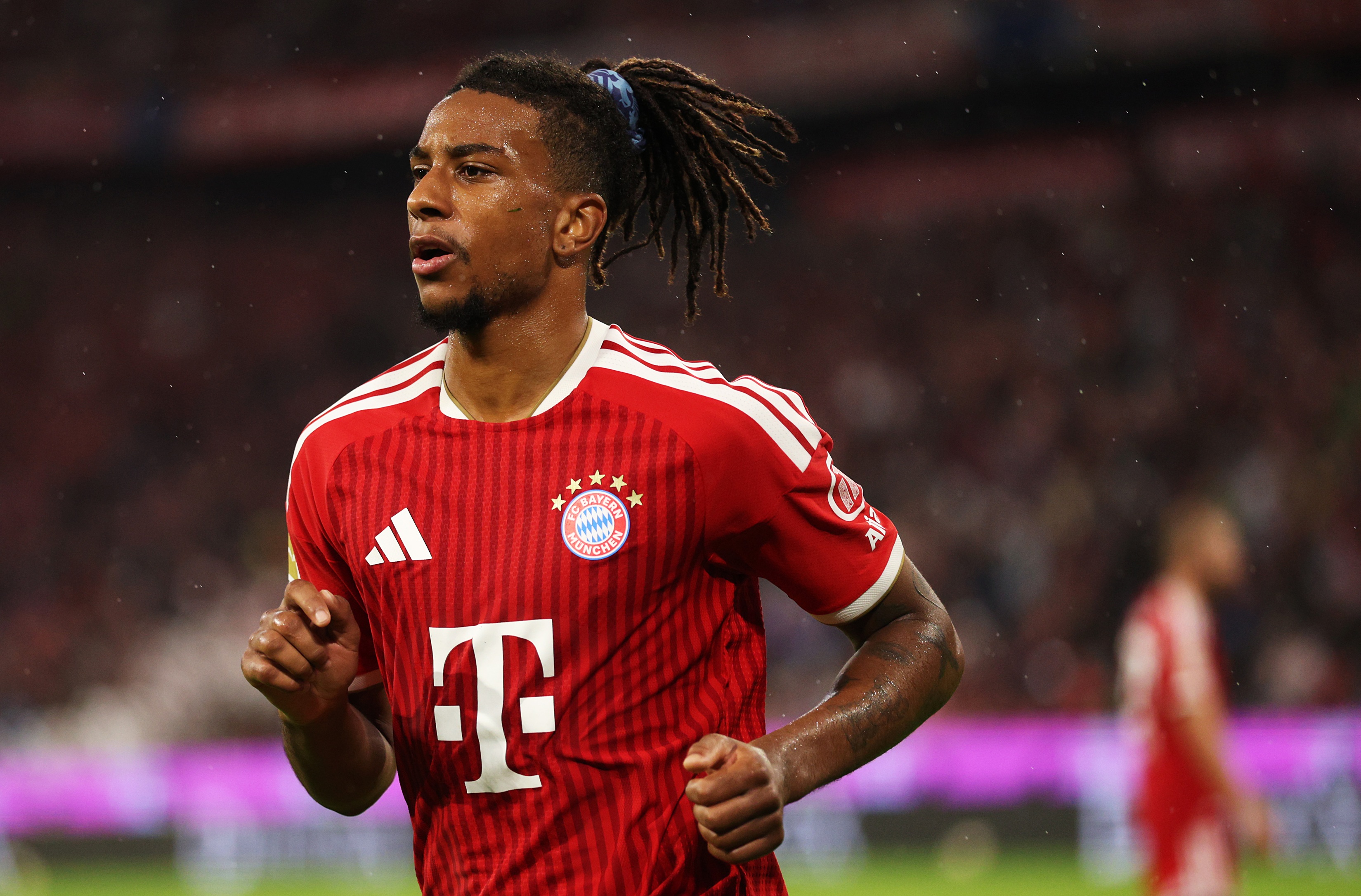 Michael Olise runs on the pitch during Bayern Munich game.